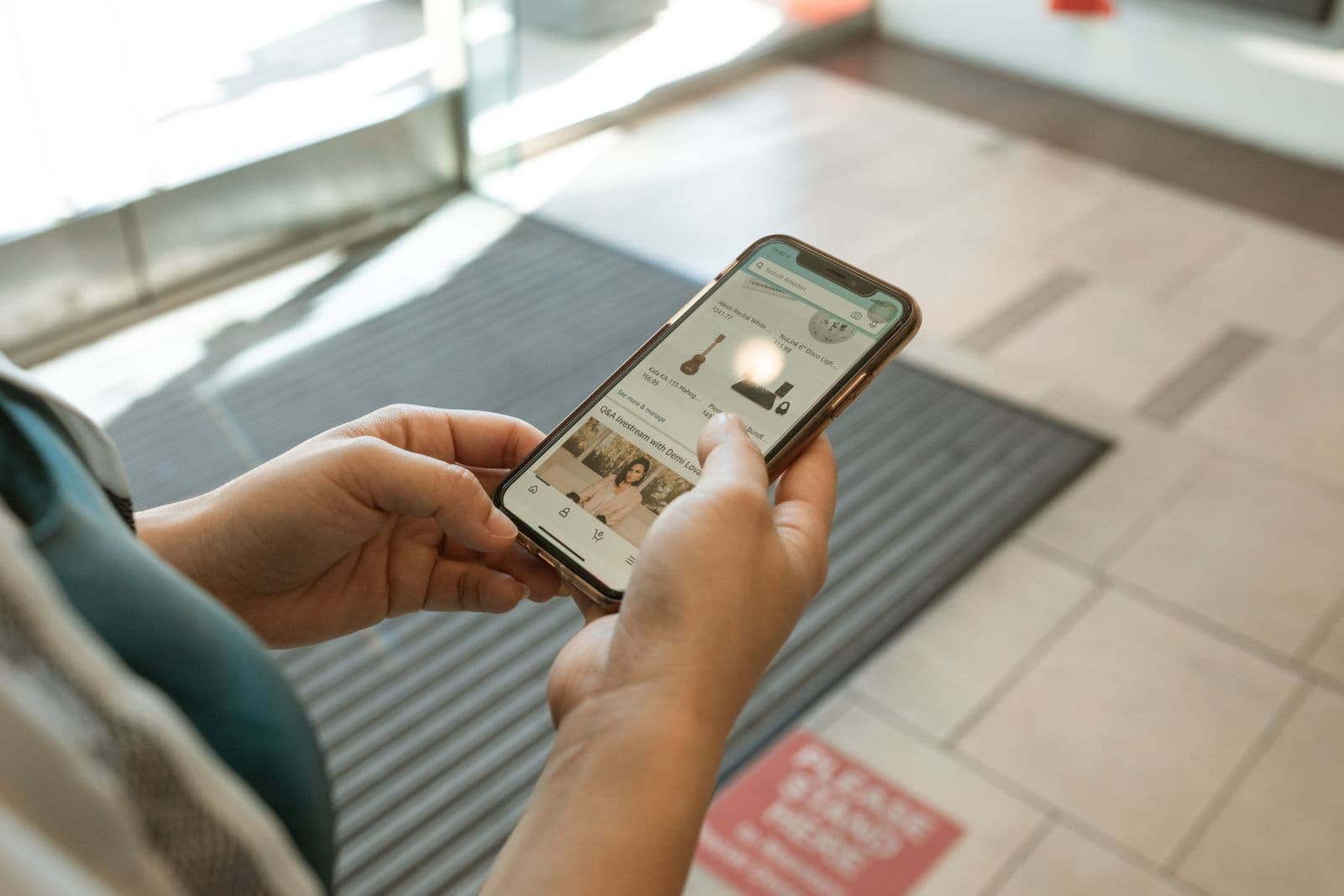 Hands holding a phone with a website open